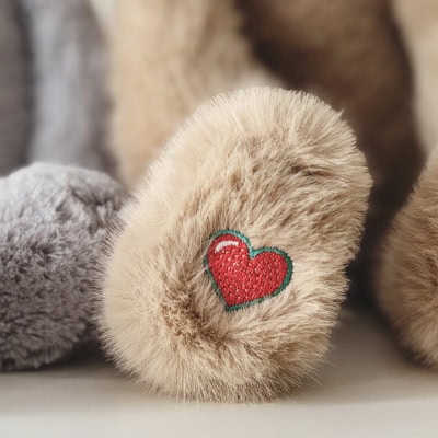 Close-up of a heartbeat bear embroidered logo